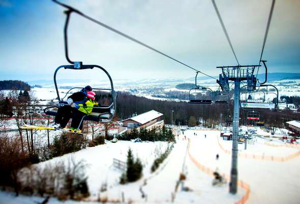 The comfortable ski lift takes you to the top of an amazing slope