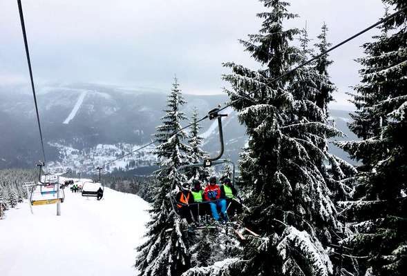 Skiing and snowboarding in the winter resort Spindleruv mlyn