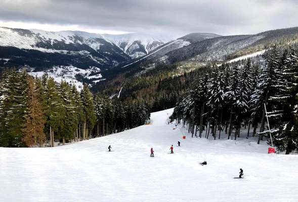 Skiing and snowboarding in the winter resort Spindleruv mlyn