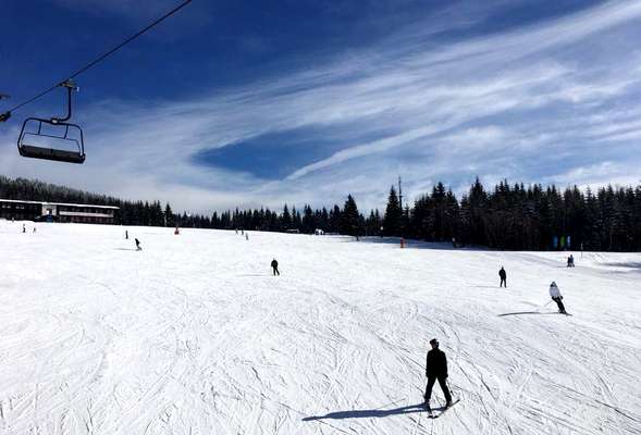 Skiing and snowboarding in the winter resort Spindleruv mlyn