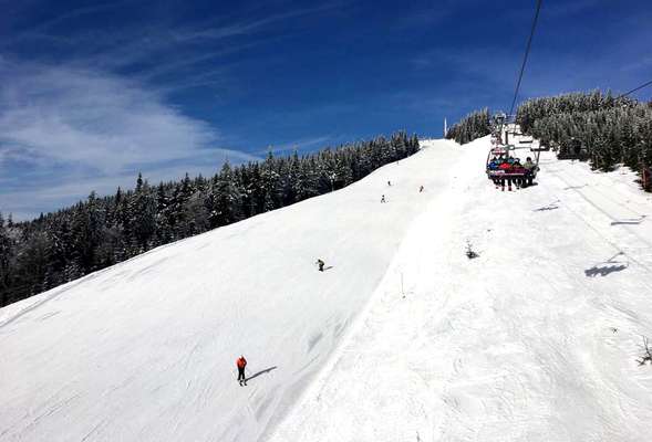 Skiing and snowboarding in the winter resort Spindleruv mlyn