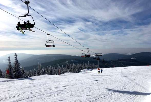 Skiing and snowboarding in the winter resort Spindleruv mlyn