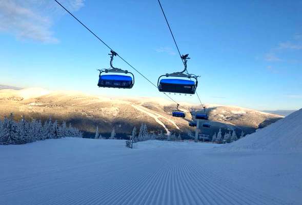 Skiing and snowboarding in the winter resort Spindleruv mlyn