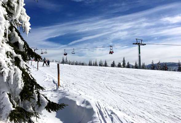 Skiing and snowboarding in the winter resort Spindleruv mlyn