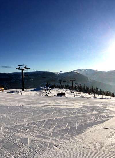 Skiing and snowboarding in the winter resort Spindleruv mlyn