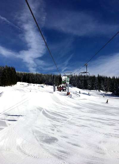 Skiing and snowboarding in the winter resort Spindleruv mlyn