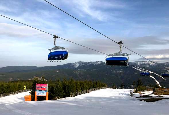 Skiing and snowboarding in the winter resort Spindleruv mlyn