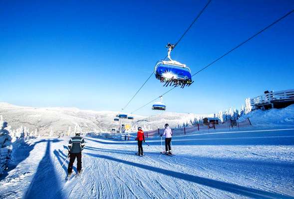 Skiing and snowboarding in the winter resort Spindleruv mlyn