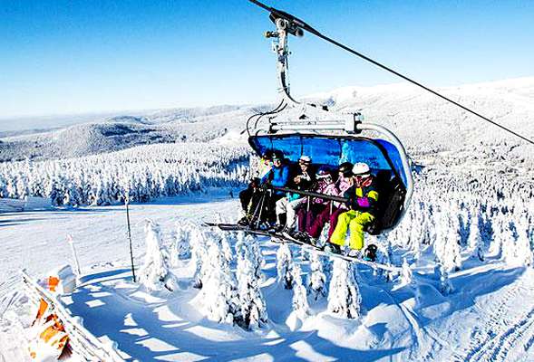 Skiing and snowboarding in the winter resort Spindleruv mlyn